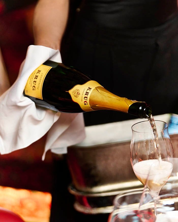 Krug champagne being poured at the table at BISOUS restaurant Amsterdam