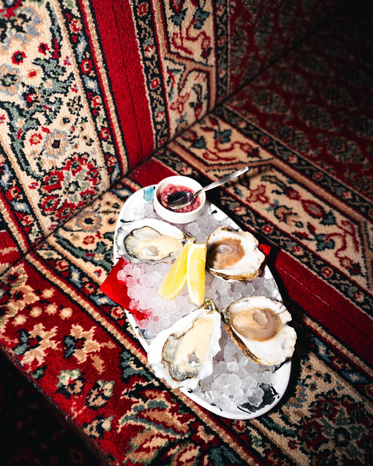 Platter of oysters on ice with lemon and mignonette at BISOUS in De Pijp, Amsterdam